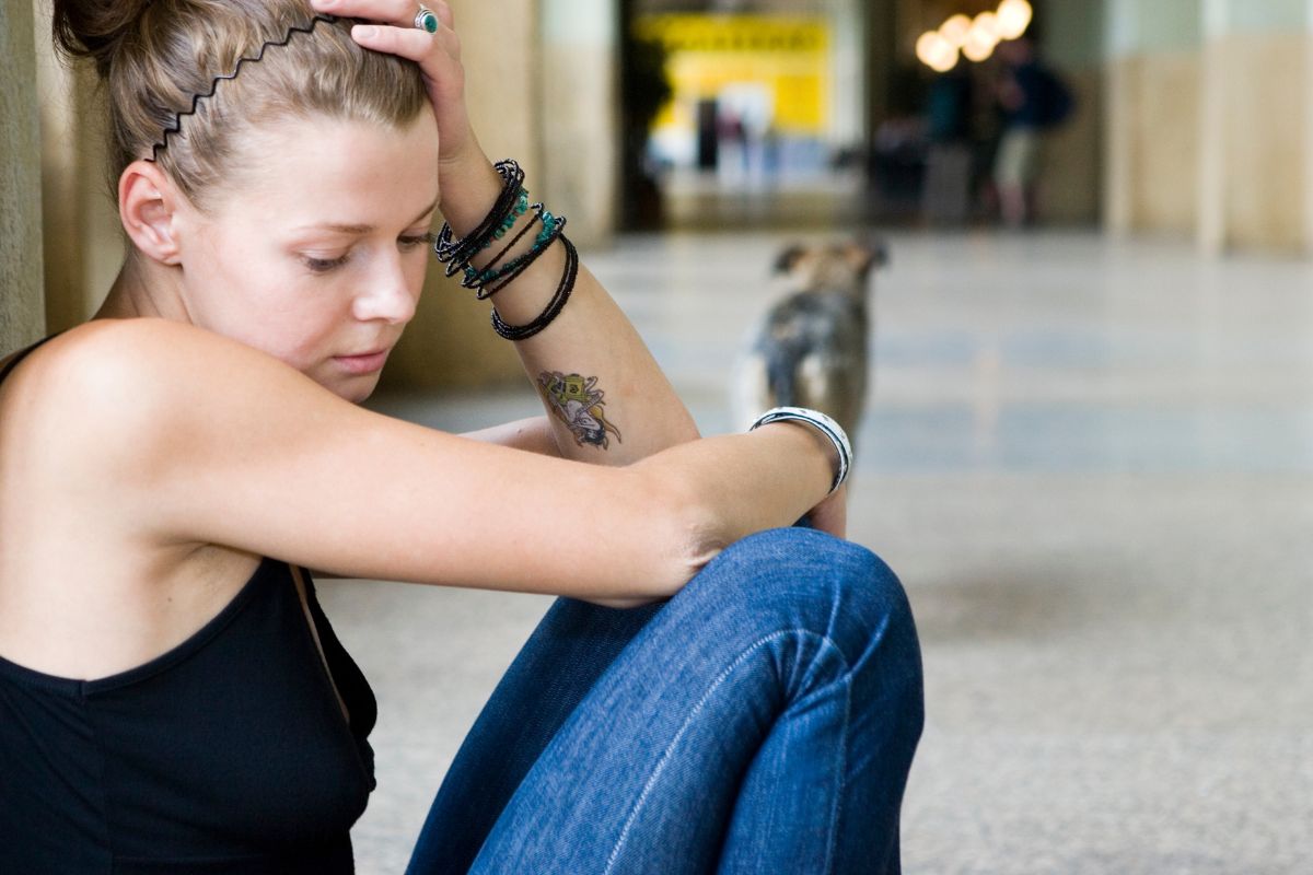 Woman displaying emotional distress and signs of abandonment issues.